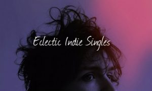 An image of a man curly hair and the words indie singles.